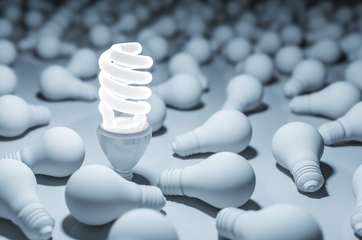 One glowing compact fluorescent lightbulb standing. 3D rendering.